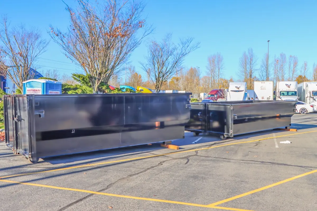 Professional dumpster rental service with roll-off container on residential driveway in Crooked River Ranch